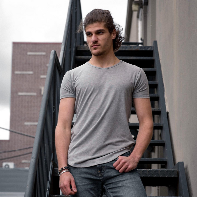 man wearing stone grey short sleeve drop tee